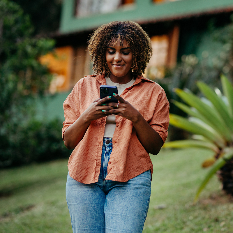 Woman using phone outdoors
